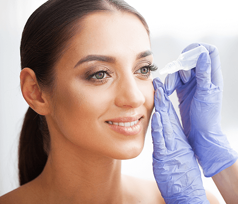 A person getting eye drops, indicating professional eye care from an optometrist. Find an optometrist near me or an eye specialist near me for your vision needs.